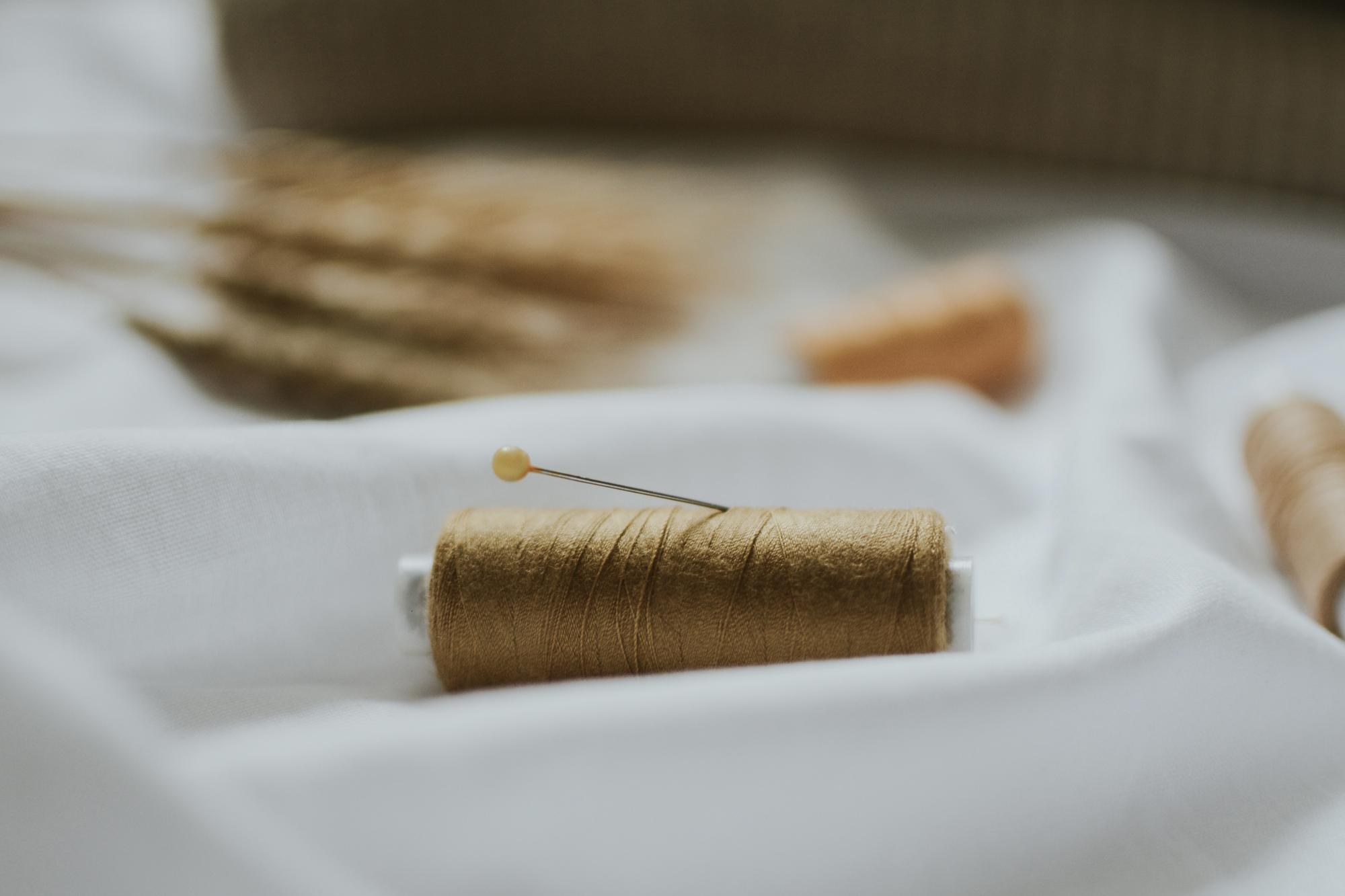 gold-thread couture embroidery on ivory linen